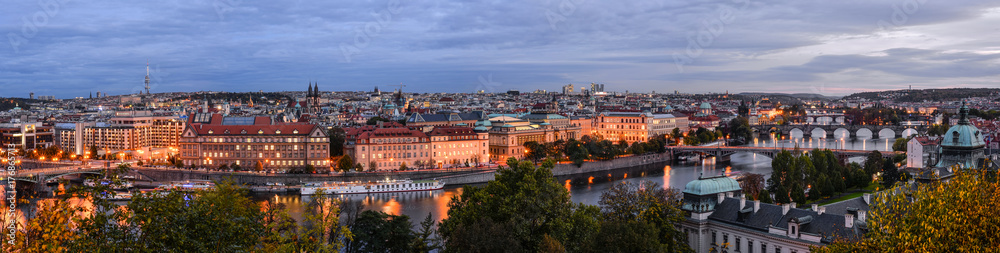 Fototapeta premium Prague, Czech Republic - October 10, 2017: Beautiful evening panorama of Prague city center, view on Intercontinental hotel, bridges across Vltava river, TV Tower, Tyn Church of Prague, Czech Republic