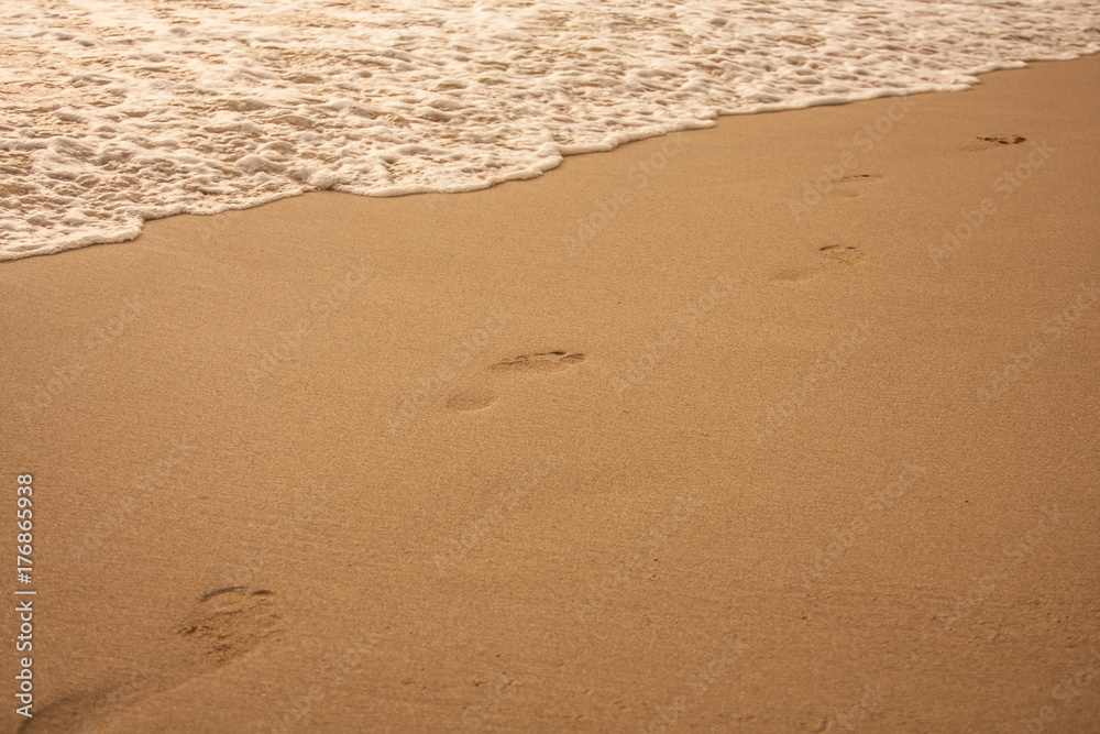 Footprints on sand of sunset beach Footprints on sand of sunset beach