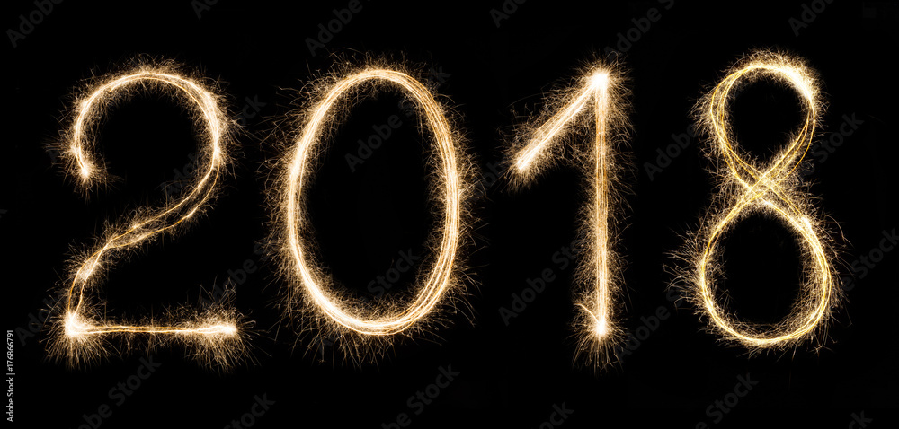 2018 written with a sparklers isolated on black background 2018 written with a sparklers isolated on black background