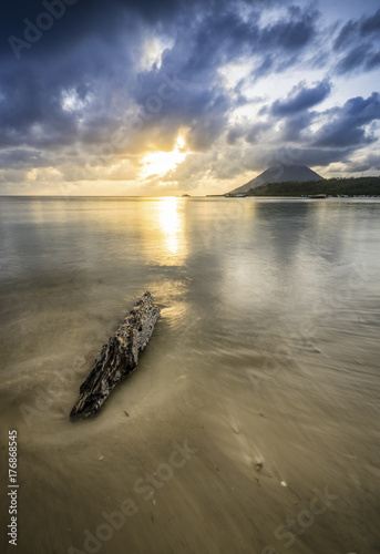 Sunset by the beach of Bunaken island, Indonesia photo