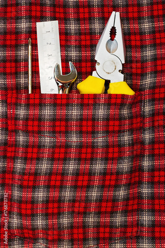 Wallpaper Mural Hand tools in checkered shirt pocket Torontodigital.ca