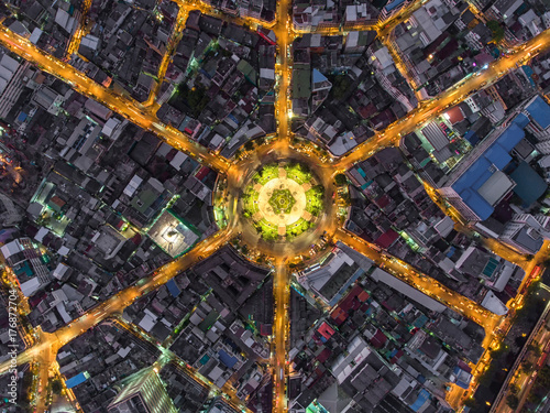 Aerial view Road roundabout, Expressway with car lots in the city in Thailand.beautiful Street , downtown,cityscape,Top view. Background,Aerial view city scape © MAGNIFIER
