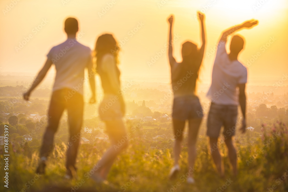 The four people dancing on the background of the city The four people dancing on the background of the city