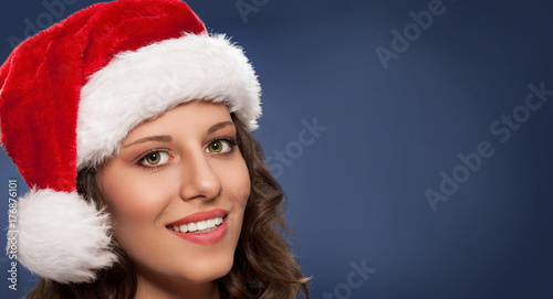 Attractive young woman in Santa hat