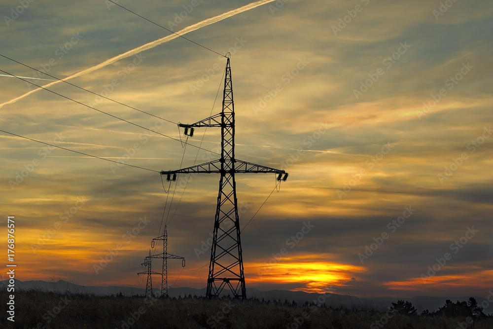 electricity pillars at sunset