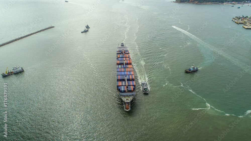 Obraz premium container,container ship in import export and business logistic,By crane,Trade Port , Shipping,cargo to harbor.Aerial view,Water transport,International,Shell Marine,transportation,logistic,trade,port