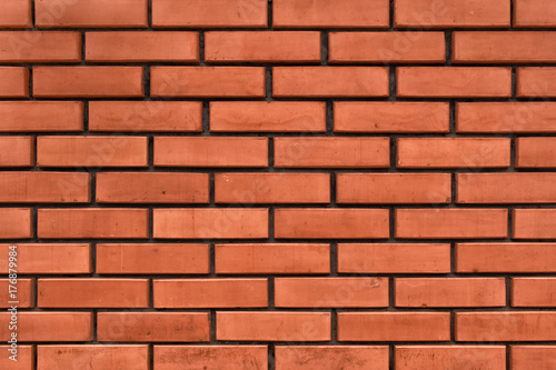 A wall made from red bricks. Brickwork texture