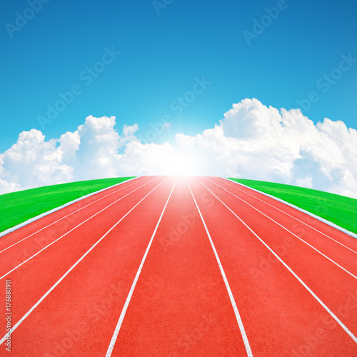 Running track in sunrise with blue sky and clouds
