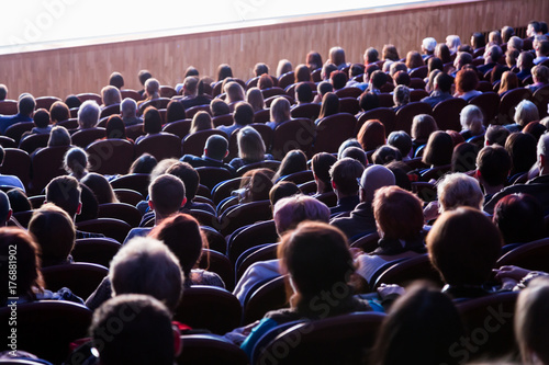 People in the auditorium during the performance. A theatrical production.