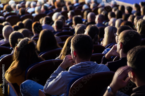People in the auditorium during the performance. A theatrical production.
