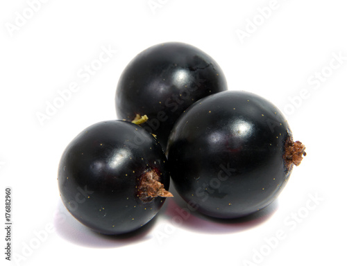 Black Currant Berries. Bunch of black currant fruits with leaf isolated on white background