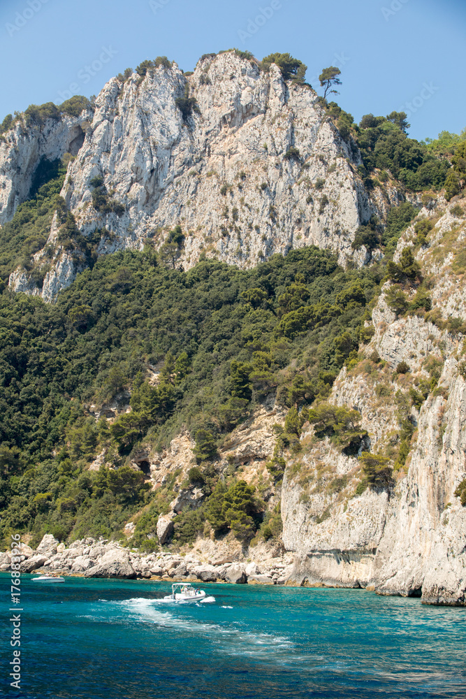 Boats with tourists near Grotta Bianca and Grotta Meravigliosa, Capri, Italy