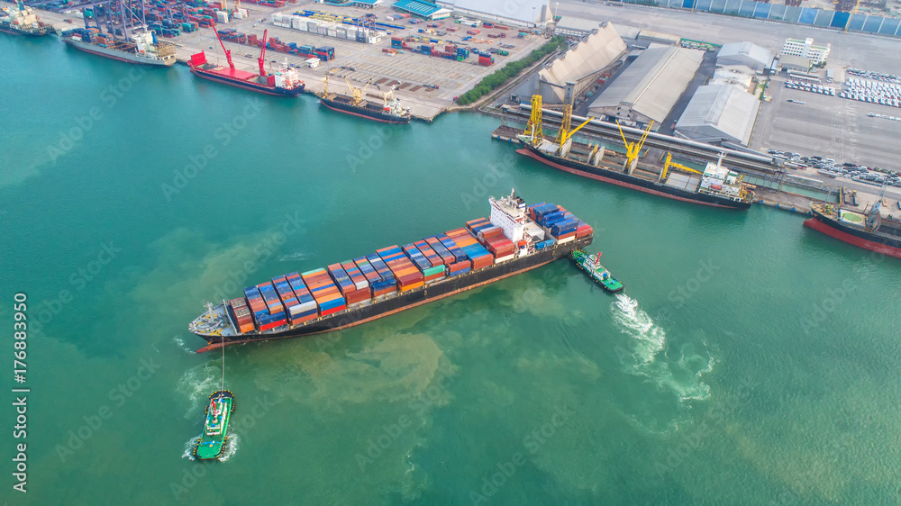 container ship in import export and business logistic.By crane ,Trade Port , Shipping,cargo to harbor.Aerial view.Water transport.International.Shell Marine.Top view.