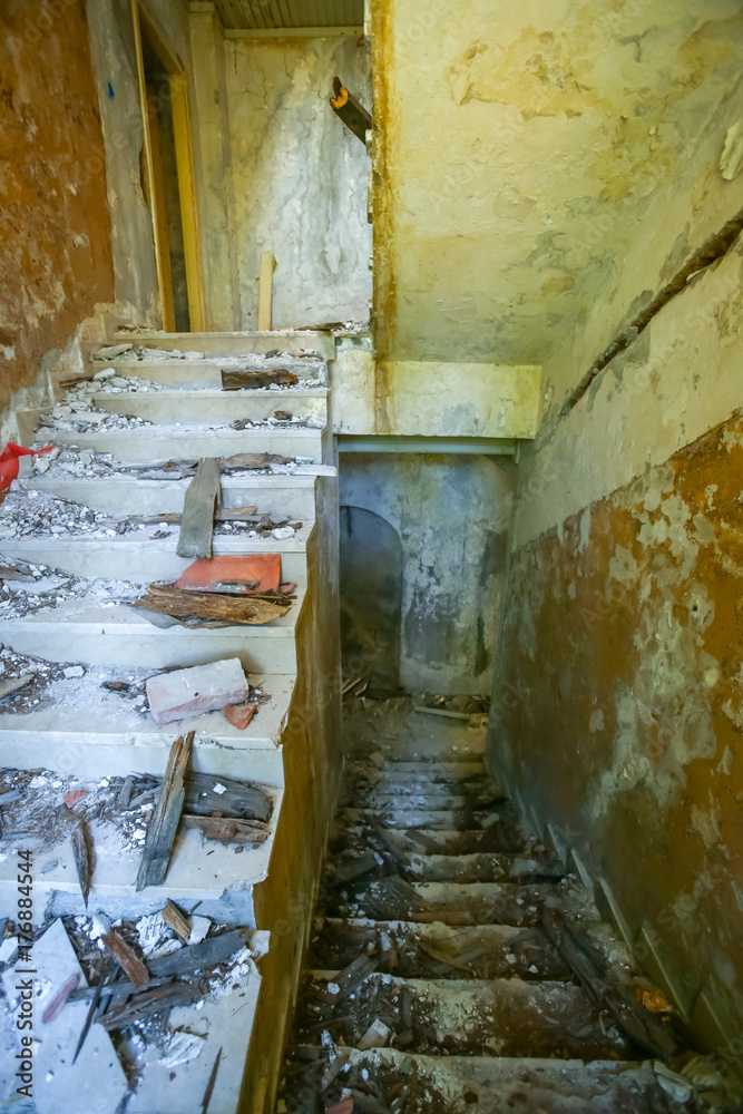 The ruined stairs of an old hotel.