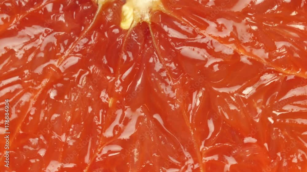 ripe grapefruit. Red color citrus fruit, rotates around the axis. Macro, studio light, advertising semk. ripe grapefruit. Red color citrus fruit, rotates around the axis. Macro, studio light, advertising semk.