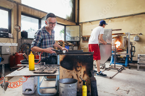 Artisan Glass Workshop - Two Young Male Glass Artists Working in Bright Workshop