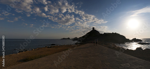 Corsica, 01/09/2017: tramonto sulla Torre della Parata, la torre genovese costruita nel 1608, con vista sulle Isole Sanguinarie, le famose isole di porfido rosso scuro photo