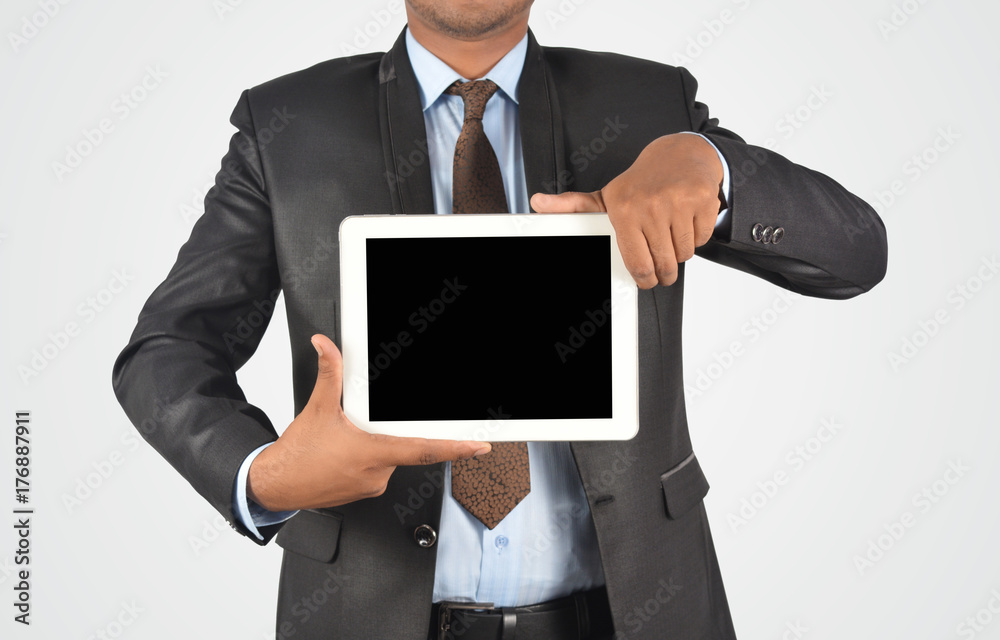 Businessman holding blank digital tablet pc, isolated very professionally Businessman holding blank digital tablet pc, isolated very professionally