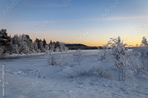 Winter lake in Finland at sunset © kochievmv