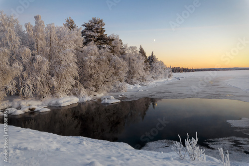 Winter lake in Finland at sunset