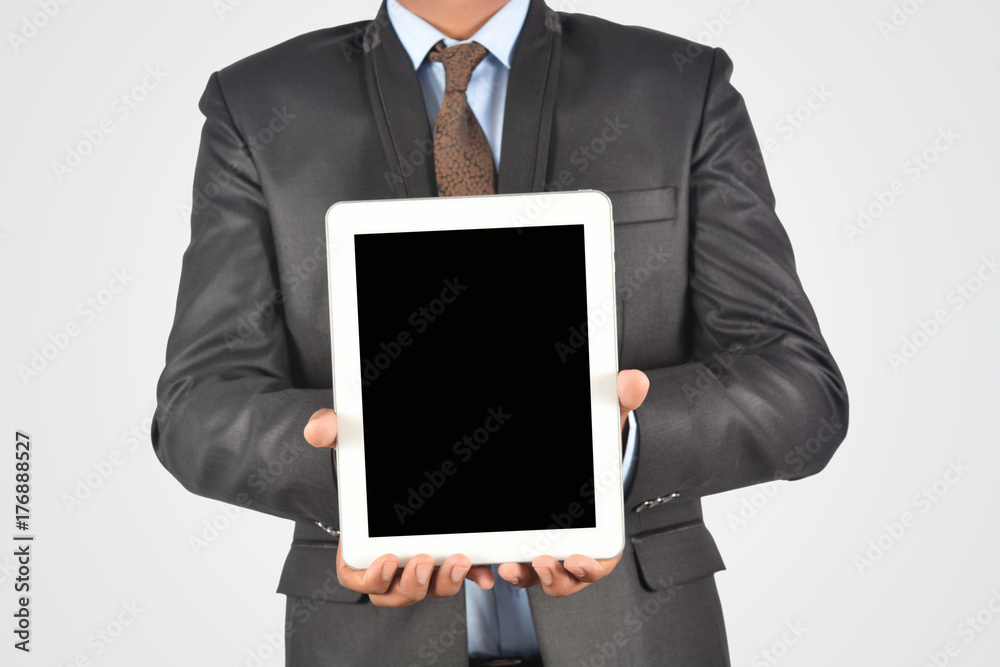 Businessman holding digital tablet pc, isolated very professionally Businessman holding digital tablet pc, isolated very professionally