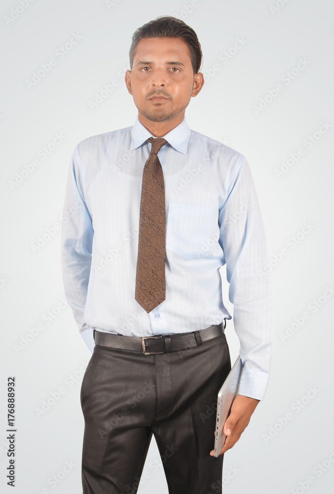 Handsome young businessman holding blank screen tablet pc, isolated very professionally