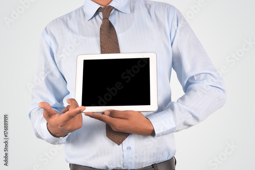 Businessman holding digital tablet pc, isolated very professionally