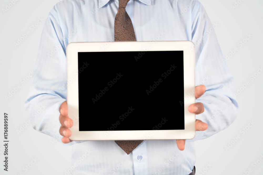 Businessman holding digital tablet pc, isolated very professionally Businessman holding digital tablet pc, isolated very professionally