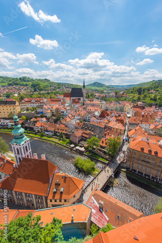 Cesky Krumlov city in vertical from aerial view with river in perfect sunny day