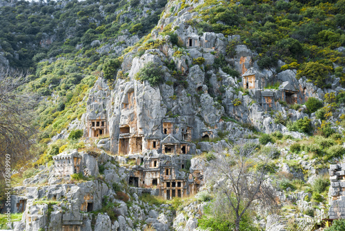 Catacombs carved into the rocks in Demre Turkey photo