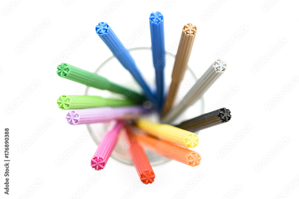 Colorful markers making forms on a white background