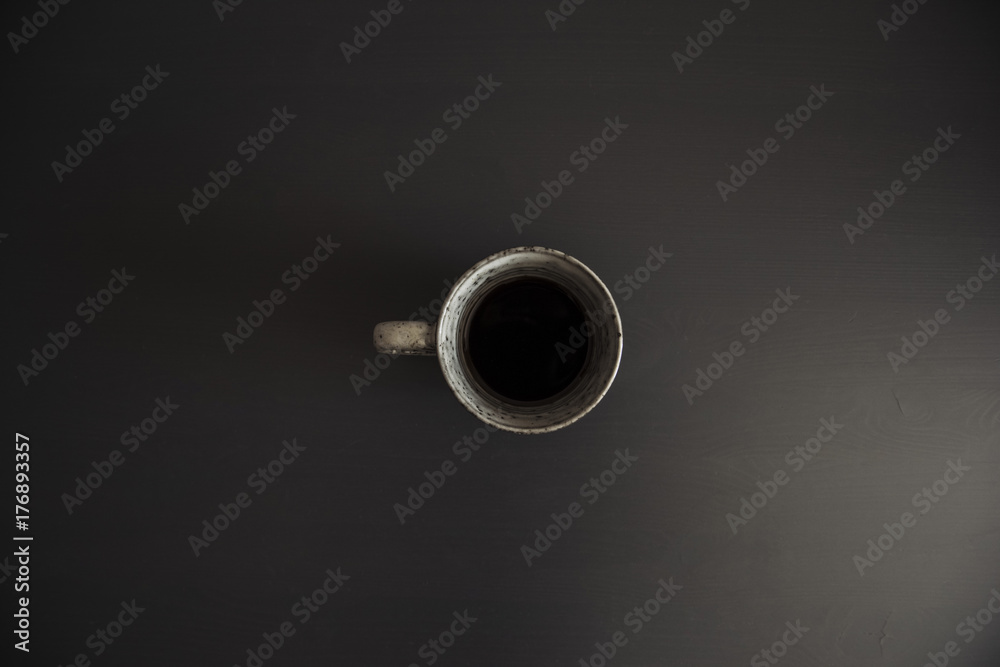 Delicious morning black coffee on the black office table,minimal setup Delicious morning black coffee on the black office table,minimal setup