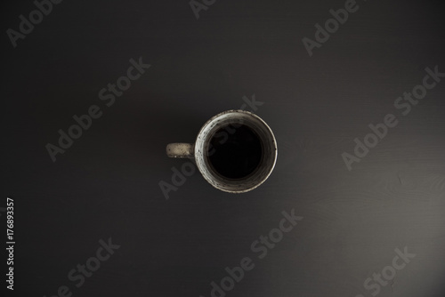 Delicious morning black coffee on the black office table,minimal setup © anastasianess