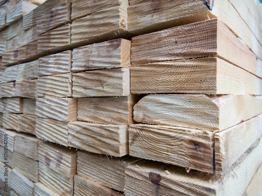 Wooden planks stacked together in a stack Wooden planks stacked together in a stack