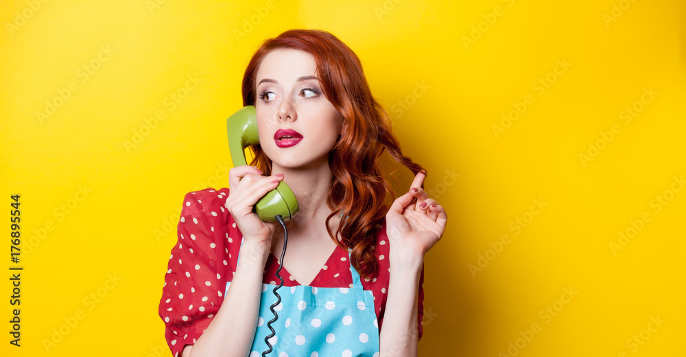 housewife with talking by phone and holding handset housewife with talking by phone and holding handset