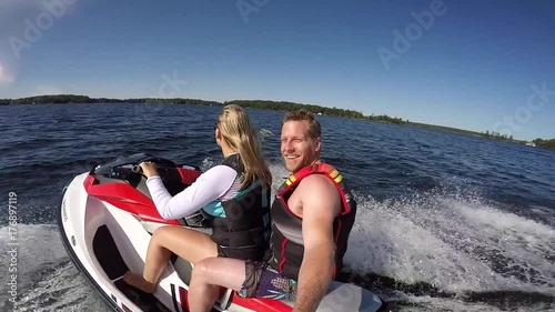 gopro seadoo male passenger smiles at camera while pretty girl drives photo