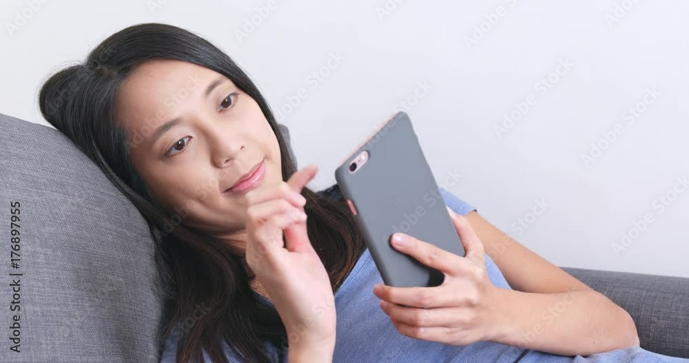 Woman use of cellphone at home Woman use of cellphone at home