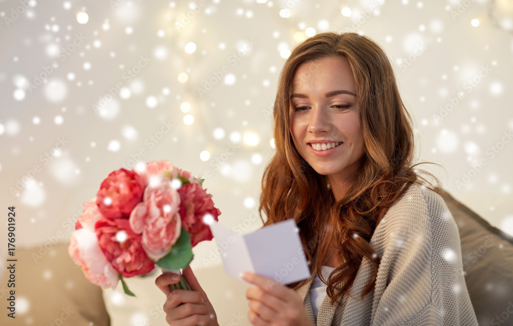 happy woman with flowers and greeting card at home happy woman with flowers and greeting card at home
