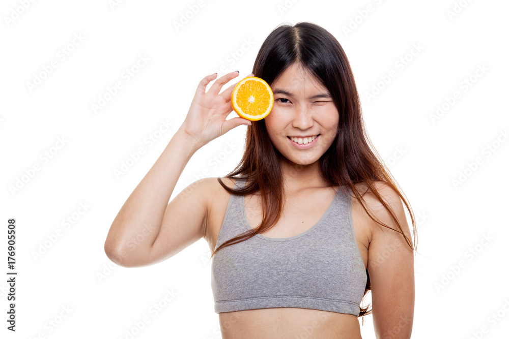 Asian healthy girl on diet with orange fruit. Asian healthy girl on diet with orange fruit.