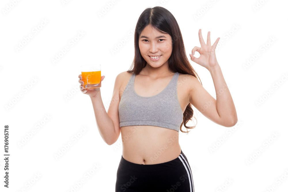 Beautiful Asian healthy girl drinking orange juice show OK sign. Beautiful Asian healthy girl drinking orange juice show OK sign.