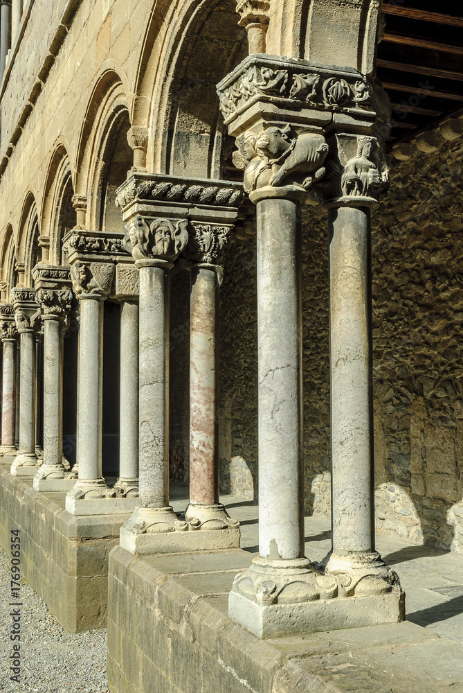 arches, columns and Romanesque capitals of the monastery of Santa Maria of Ripoll, in Catalonia, Spain.