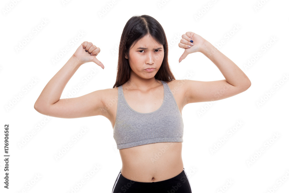 Unhappy Asian girl in sport dresses show thumbs down with both hands. Unhappy Asian girl in sport dresses show thumbs down with both hands.