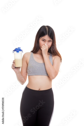 Beautiful Asian healthy girl hate whey protein smell. © halfbottle