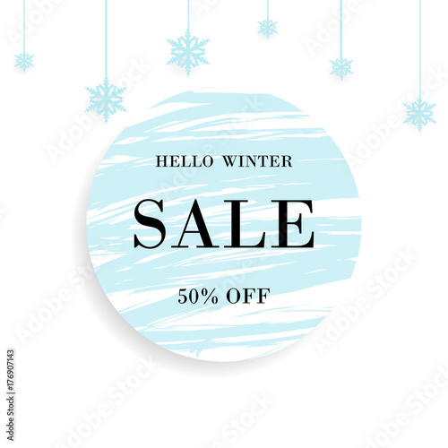 Winter Sale. Special offer banner With lettering hello winter, christmas ball and snowflakes design element and blue circle brush stroke background for business, promotion and advertising. photo