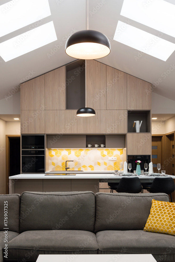 Living-room connected with kitchen in background, contemporary house  interior Stock Photo | Adobe Stock