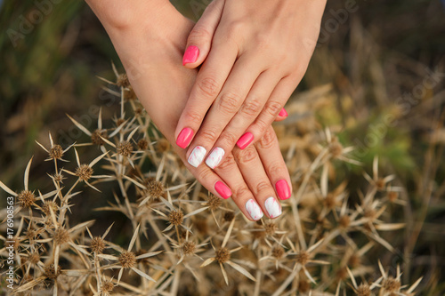 Natural nails with colorful manicure, pink, marble and white polish on women nails. Nails of woman with creative marble ornament, festive autumn manicure  © Wedding photography