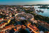 Pula Arena at sunset - HDR aerial view taken by a professional drone. The Roman Amphitheater of Pula, Croatia