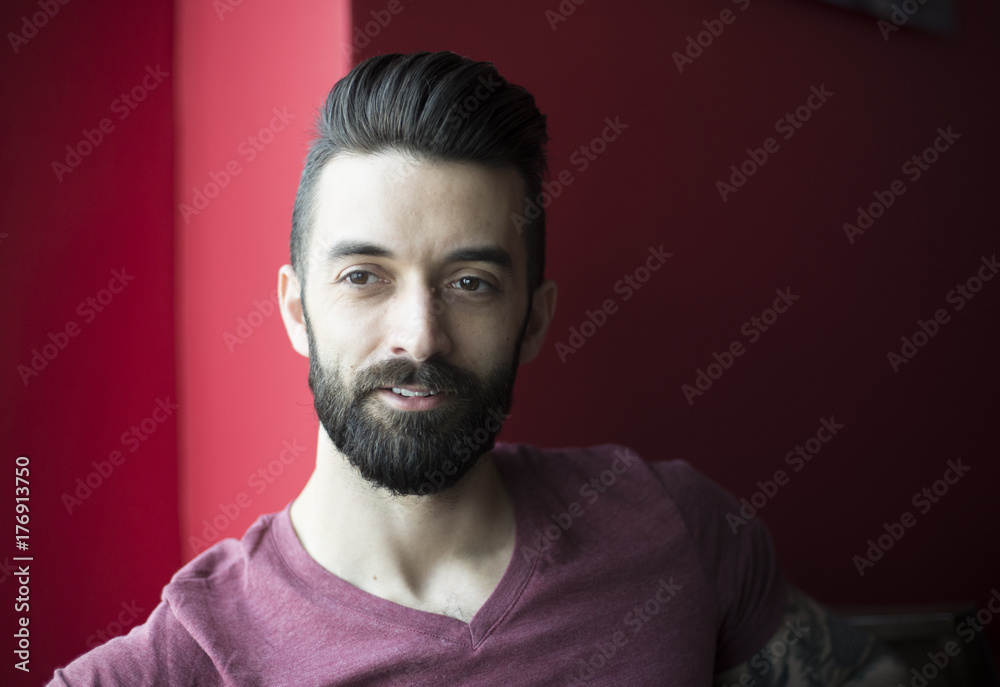 Portait of a good looking man on a red background Portait of a good looking man on a red background