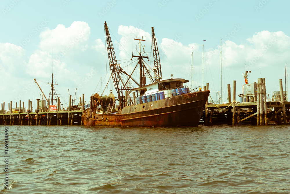 Rusted fishing boat. Old crab lobster shrimp boat. Rusty steel boat docked. Fishing marine boat at dock