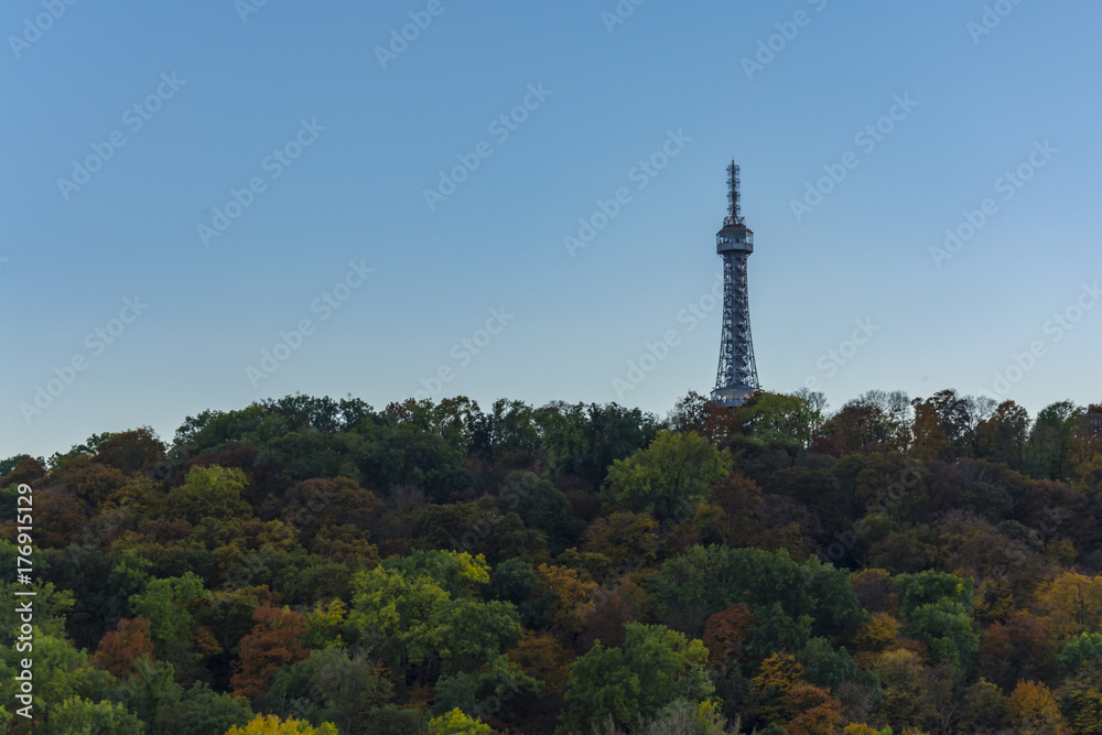 The Petrin tower is lighting during sunny day. Day view on Prague. 